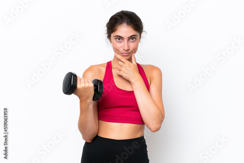 Young sport caucasian woman making weightlifting isolated on white background thinking