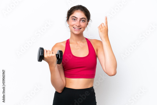 Young sport caucasian woman making weightlifting isolated on white background pointing up a great idea