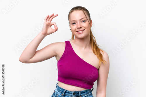 Young caucasian girl isolated on white background showing ok sign with fingers © luismolinero