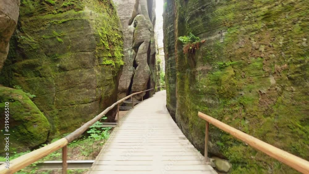 POV from hiking the wooden planks of the path through the steep sandstone cliffs in the rock town of Adersbach, Czech Republic.
