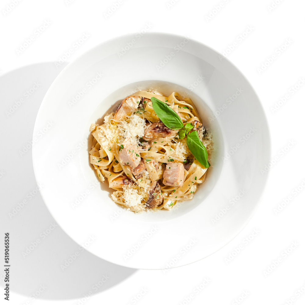 Traditional Italian lunch - pasta fettuccine with chicken and mushrooms with parmesan cheese. Creamy pasta with mushroom and chicken. Chicken and mushroom in cream sauce with homemade pasta. Traditional Italian lunch - pasta fettuccine with chicken and mushrooms with parmesan cheese. Creamy pasta with mushroom and chicken. Chicken and mushroom in cream sauce with homemade pasta.