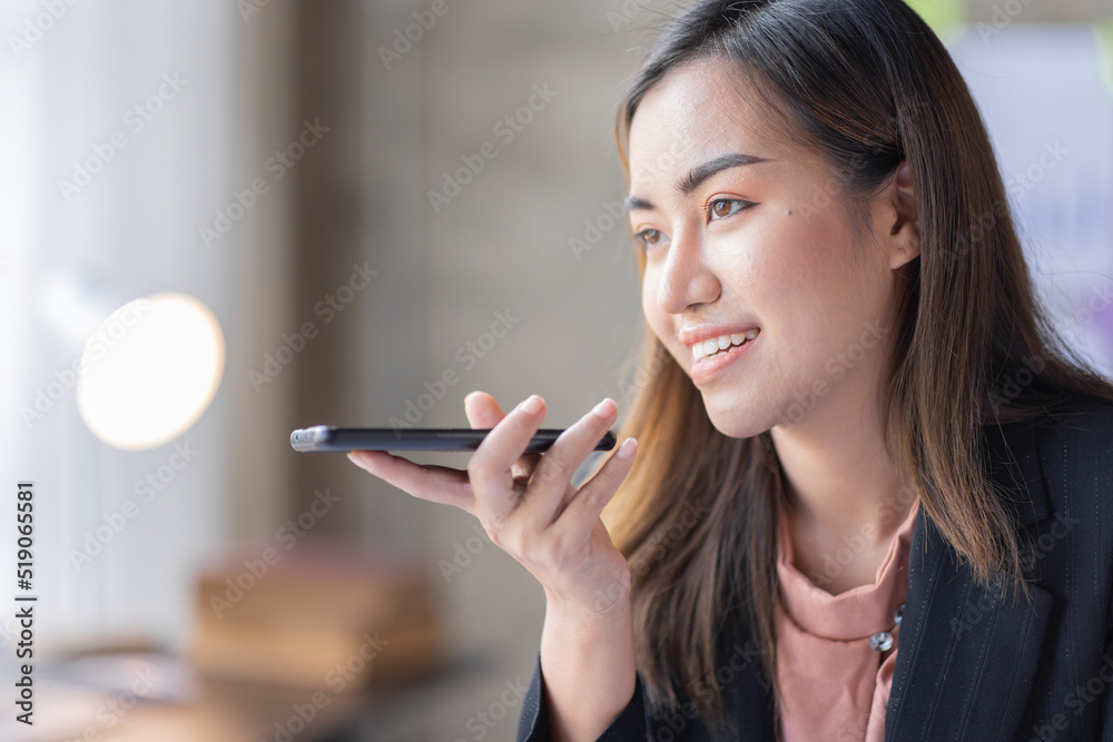 Young Business asian woman talking on smartphone and working in office. Asian female Business sitting at his workplace. Young Business asian woman talking on smartphone and working in office. Asian female Business sitting at his workplace.