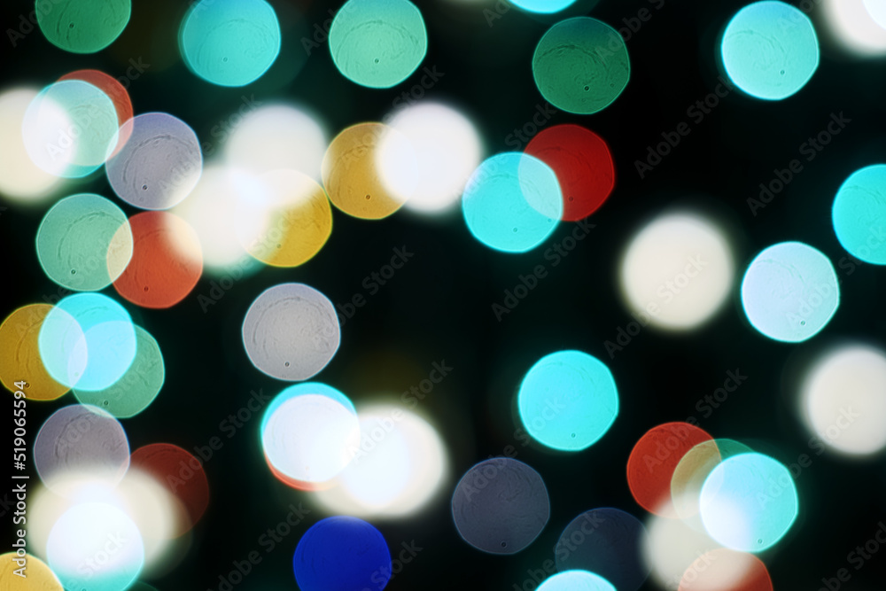 Fototapeta premium multicolored festive lights on a black background screensaver backdrop
