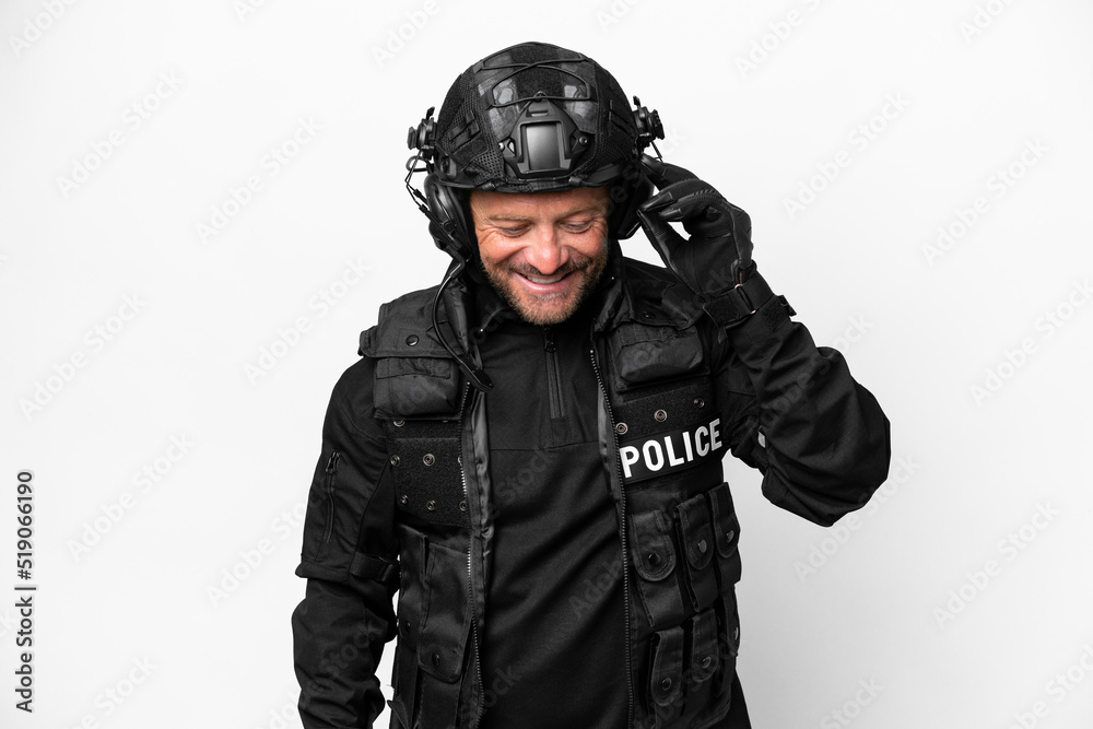 Middle age SWAT man isolated on white background laughing