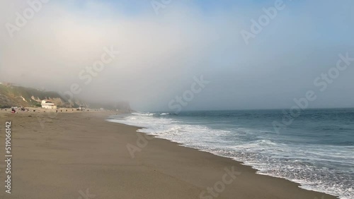 4k Malibu Beach Blue and Green Ocean waves crash into the shore on a cloudy day b roll photo