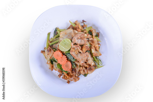 Stir-fried Noodles in Sweet Soy Sauce with Pork ( Pad See-Ew ) on white bowl for Thai food and isolate background with clipping path