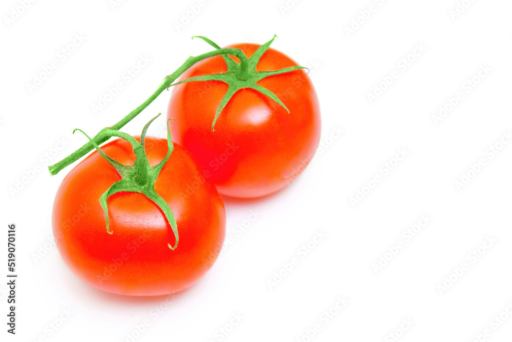Two cocktail tomatoes on a vice isolated Two cocktail tomatoes on a vice isolated