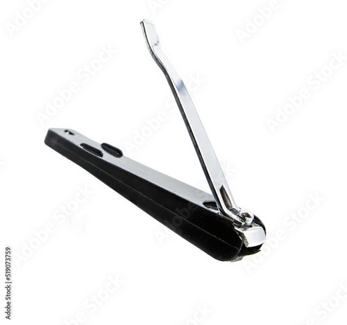 Silver nail clipper suspended on isolated white background, copy space, instrument used to cut nails