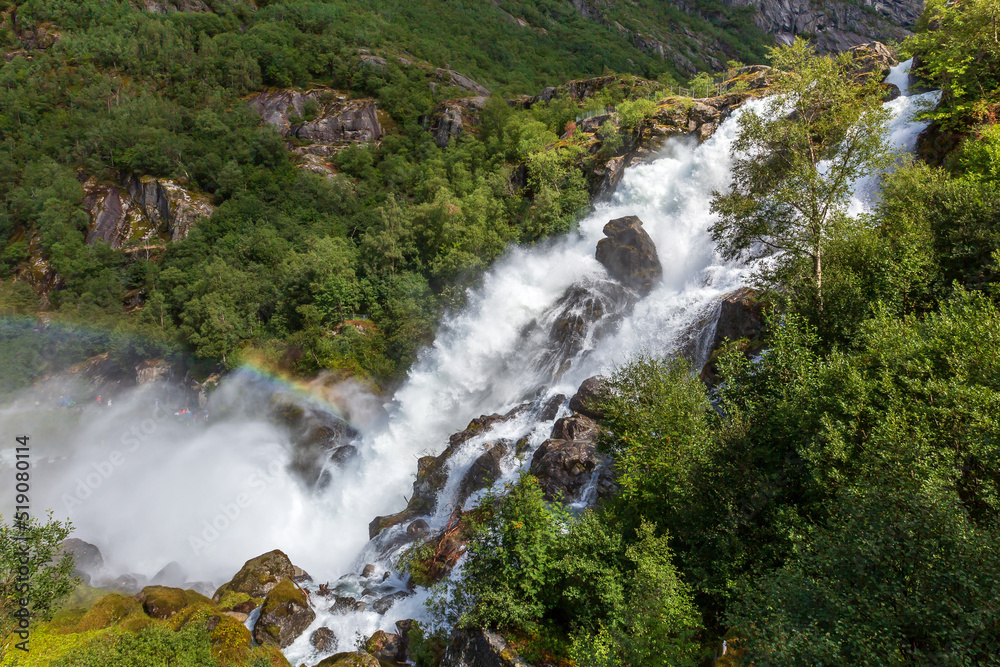 Naklejka premium Rainbow and Briksdal waterfall in Norway