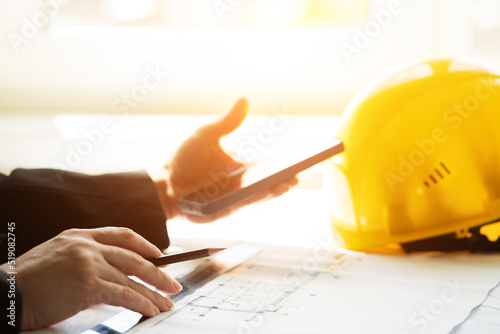 workplace architect builder at the construction site, Architecture and construction. Creating an interior design by an architect engineer on the blueprints on the Desk in the office