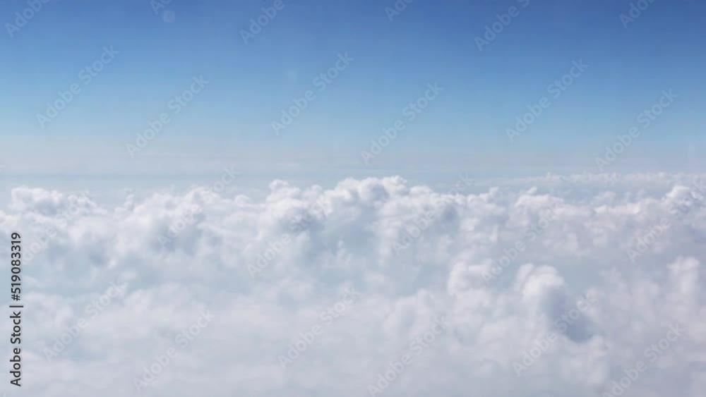 view from an airplane above the clouds, flying in the sky view from an airplane above the clouds, flying in the sky