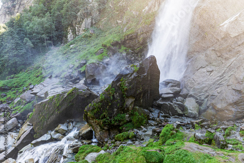 Foroglio waterfall splashing on rock photo