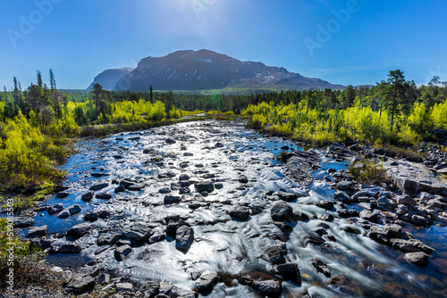 Sweden, Norrbotten County, River flowing inStora Sjofallet National Park photo