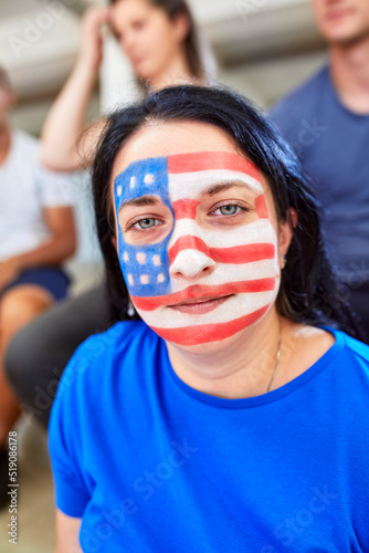 Woman with American flag painted on face photo