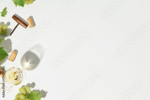 Flat-lay of  white wine  on white background with copy space photo