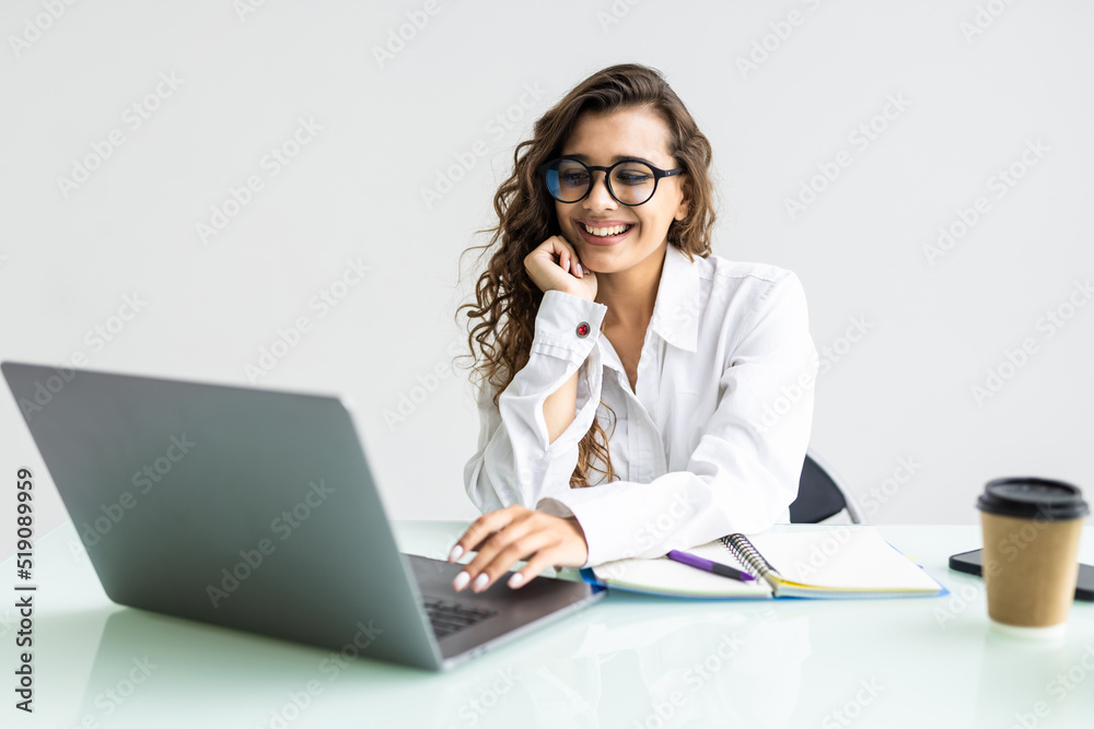 Portrait of a businesswoman using laptop in office Portrait of a businesswoman using laptop in office