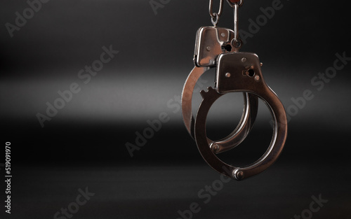 Stampa su tela handcuffs on a dark background, concept arrest imprisonment.