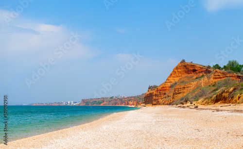 Lyubimovka beach coastal view with red cliffs. Crimea © evannovostro