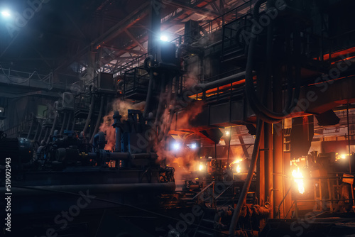 Steel mill for iron pipes or tubes for water production. Metallurgy foundry factory interior. © DedMityay