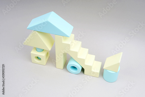 Yellow and blue details of a wooden constructor. Popular colors.