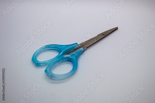 isolated defocus blue scissors on a white background