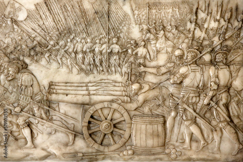 Basilica of St. Denis. Tomb of Francis 1 king of France and Claude of France. Foundation's low relief. Depiction of the battle of Marignano in 1515 - the Old Swiss Confederacy troops. photo