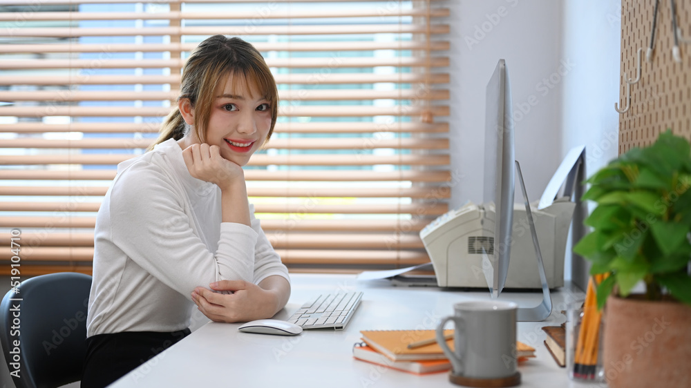 Beautiful young woman working online at home with modern devices Beautiful young woman working online at home with modern devices