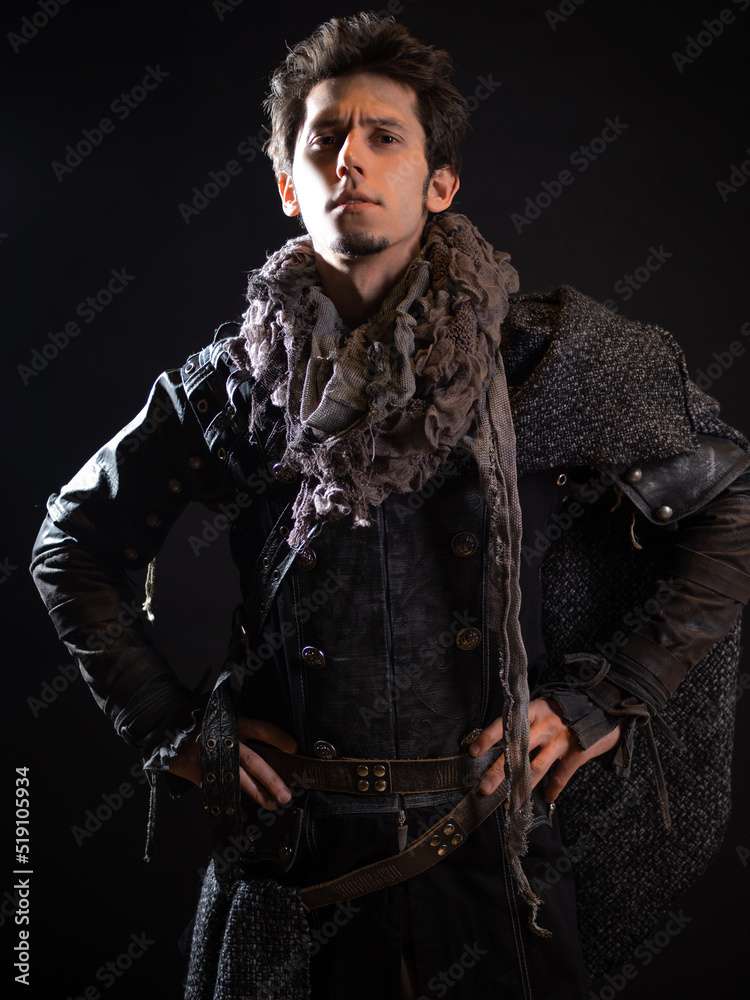 A guy in a steampunk or post-apocalyptic image, portrait on a black background A guy in a steampunk or post-apocalyptic image, portrait on a black background