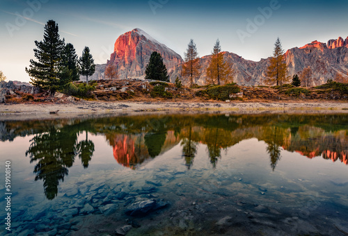 Calm autumn scene of Limides Lake and Lagazuoi peak on background. Picturesque morning view of Dolomite Alps, Falzarego pass, Italy, Europe. Beauty of nature concept background. photo