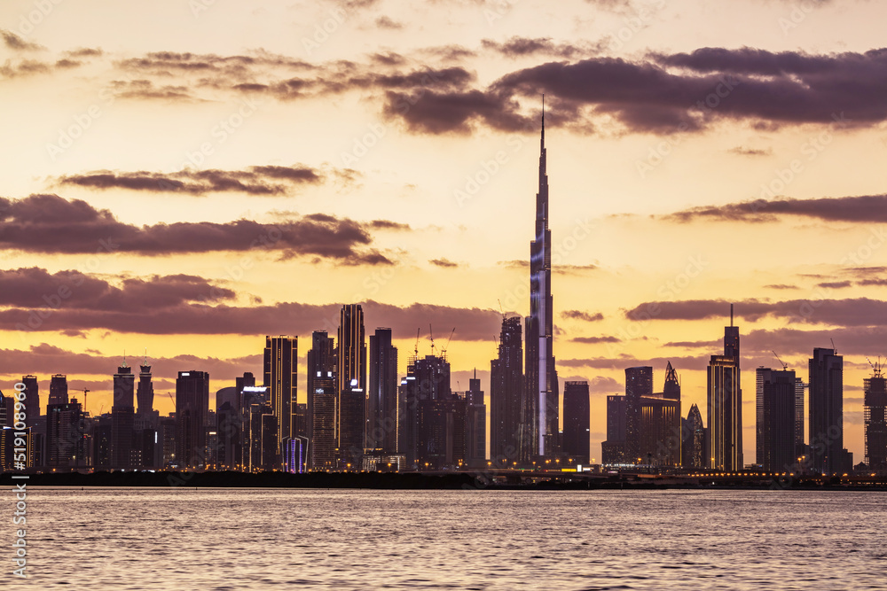 Skyscrapers skyline of Dubai UAE downtown with Burj Khalifa at sunset Skyscrapers skyline of Dubai UAE downtown with Burj Khalifa at sunset