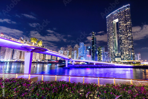 Canvas Print Dubai marina skyscrapers in UAE next to jumeirah beach at night.