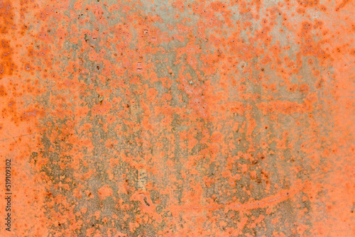 Abstract orange background with defects and rust