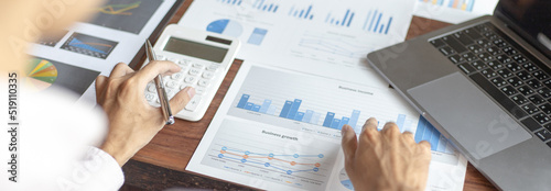 Business men analyze financial graphs and find break-even points for investments in order to reduce costs and reduce corporate taxes, Analysis of financial accounting and real estate investment.