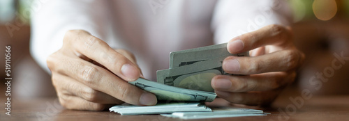 Businessmen are counting dollar amounts and paying bonuses to accountants, Giving a salary or bonus to employees, bank, finances concept.
