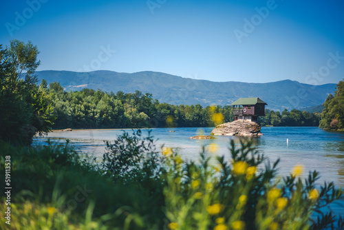 Drina river with famous house on the rock. Summer landscape, travel to Serbia photo