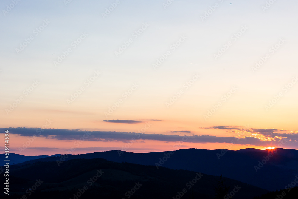 Fototapeta premium Beautiful sunset landscape with mountains