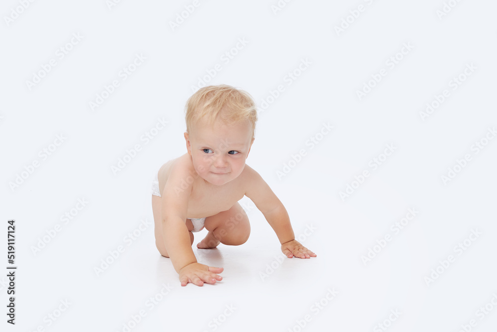 Cute little baby in a diaper on a white isolated background Cute little baby in a diaper on a white isolated background