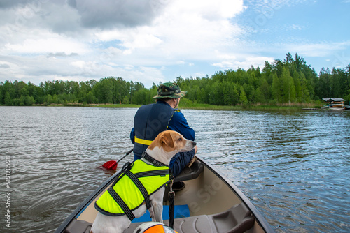 Canoeing at lake with dogs