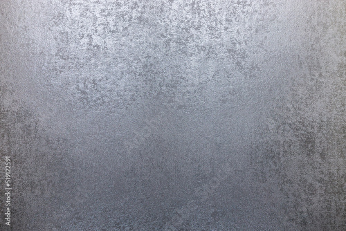 Fragment of fabric wallpaper surface with glossy silver textures