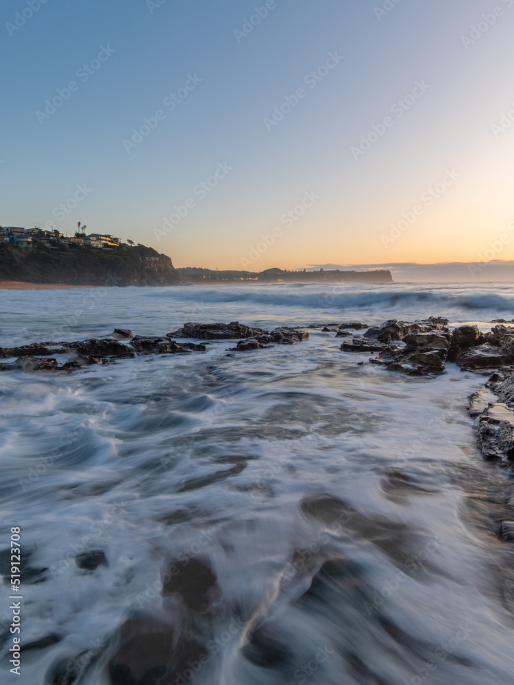 Ocean water flowing into the rocky shore.