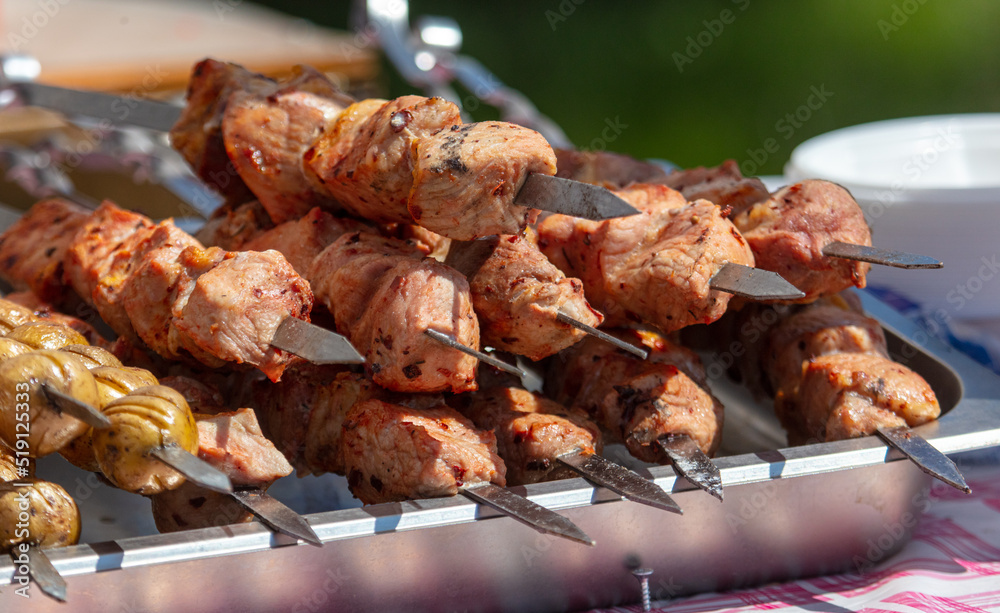 Meat on skewers grilled on coals.