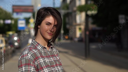 Wallpaper Mural Portrait of young beautiful smiling woman looking in front of the camera. Female posing into the camera at the street Torontodigital.ca