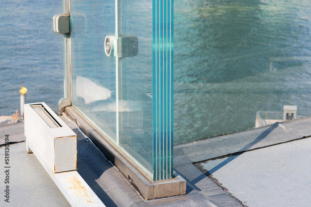 Naklejka premium Resistant laminated glass structure special thickness layer installed on aluminium frame. 