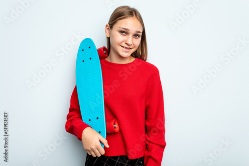 Young skater caucasian girl isolated on blue background happy  smiling and cheerful.