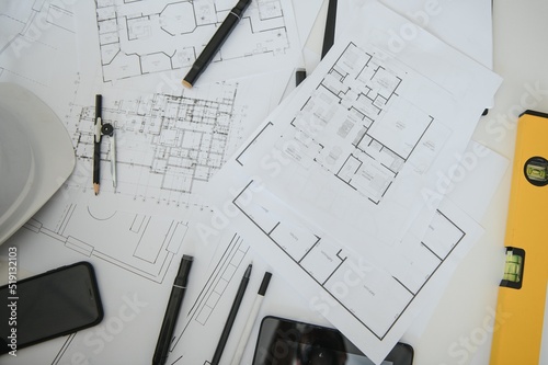 architect design working drawing sketch plans blueprints and making architectural construction model in architect studio,flat lay.