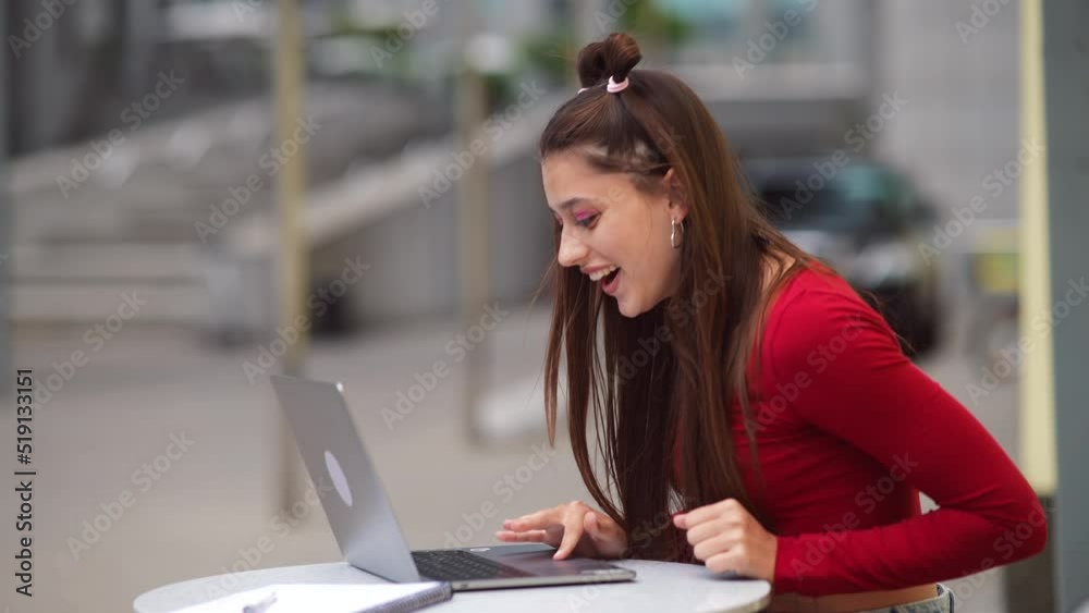 Freelancer woman in a summer cafe doing remote work. Freelancer woman in a summer cafe doing remote work.