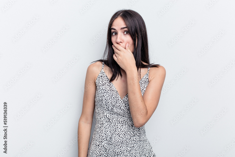 Young caucasian woman isolated on white background covering mouth with hands looking worried. Young caucasian woman isolated on white background covering mouth with hands looking worried.