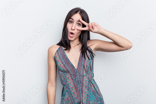 Young caucasian woman isolated on white background dancing and having fun.