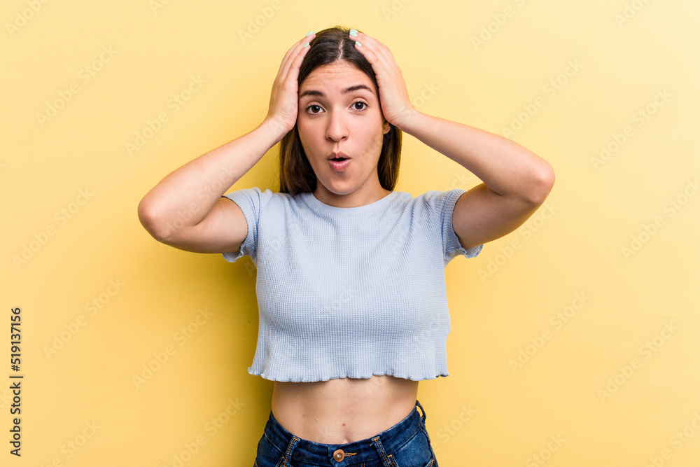 Young caucasian woman isolated on yellow background being shocked, she has remembered important meeting. Young caucasian woman isolated on yellow background being shocked, she has remembered important meeting.