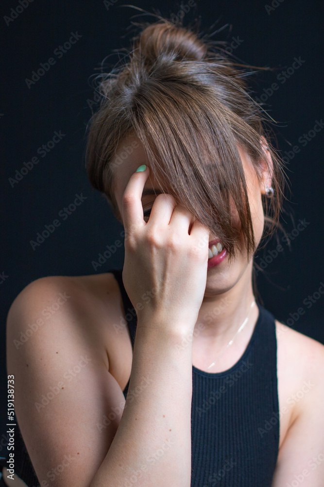 Woman portrait with face in hands. Portrait Beautiful Girl on black background. Girl with Woman portrait with face in hands. Portrait Beautiful Girl on black background. Girl with